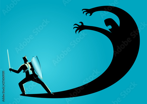 Businessman as a knight fighting his own shadow photo