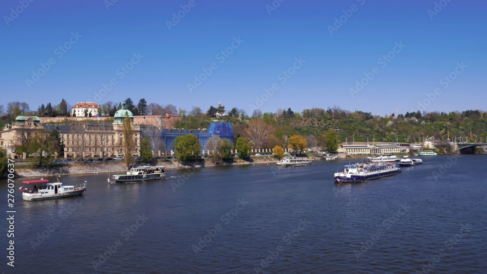 Aerial view of the vessel sailing on the water channel of Prague. Czech