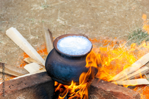 A pot filed with milk on fire and close to overflow. This is the ritual of Milk Overflow ceremony in Sinhala and Tamil New Year Festival in the month of April, Sri Lanka