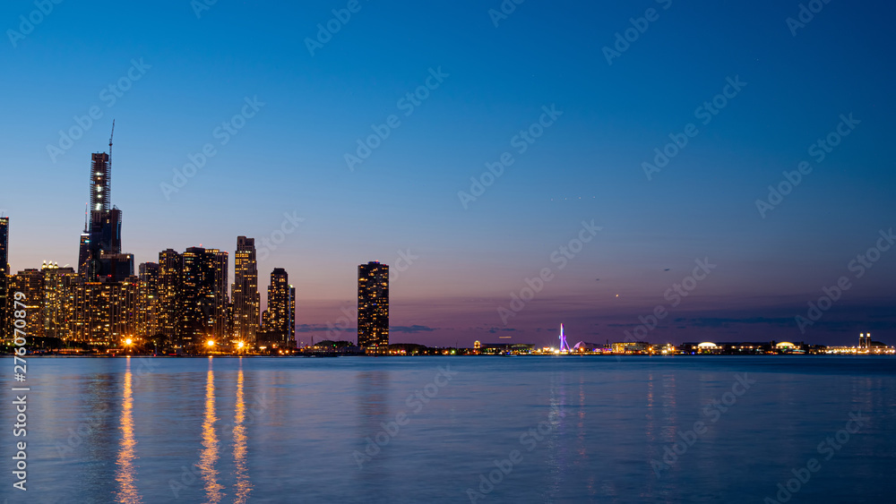 Chicago skyline in the evening from Lake Michigan - CHICAGO, ILLINOIS - JUNE 12, 2019 Chicago skyline in the evening from Lake Michigan - CHICAGO, ILLINOIS - JUNE 12, 2019