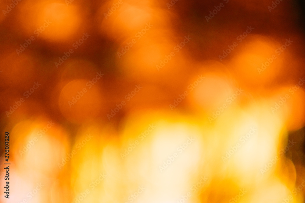 Red and yellow bokeh lights. Defocused lens flare. Autumn leaves design. Abstract art background. Red and yellow bokeh lights. Defocused lens flare. Autumn leaves design. Abstract art background.