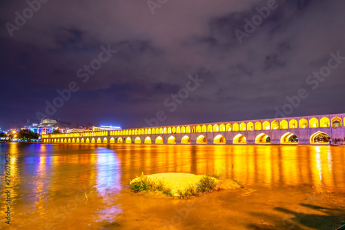 Night view of Si-o-se bridge known as Allahverdi Khan Bridge, bridge on river Zayanderud in city of Isfahan photo