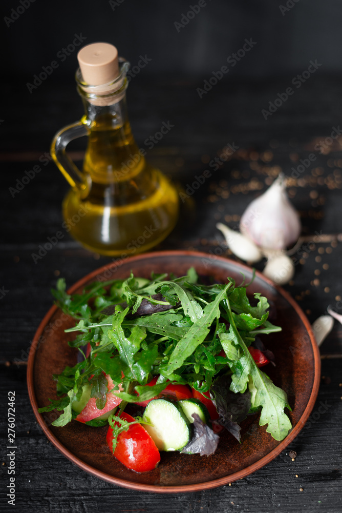 raw food vitamin vitamin salad laid out on a clay plate tomatoes cucumbers basil arugula raw food vitamin vitamin salad laid out on a clay plate tomatoes cucumbers basil arugula