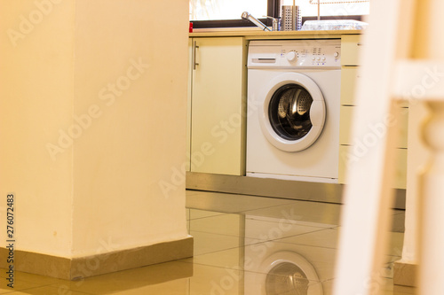 washing machine in kitchen pastel yellow color interior design indoor environment creative foreshortening in furniture frame 