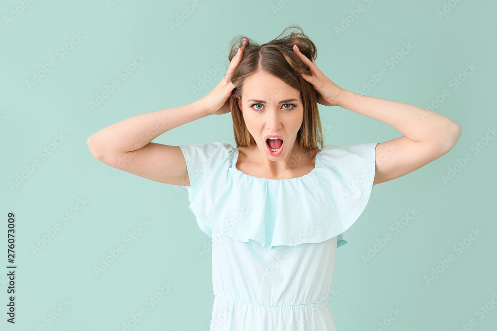 Stressed young woman on color background Stressed young woman on color background