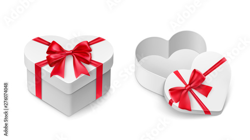 White cardboard gift boxes in love heart shape with sparkling red ribbon bows. Realistic container for chocolate candies vector illustration. Valentines day gift packaging. Romantic and lovely present
