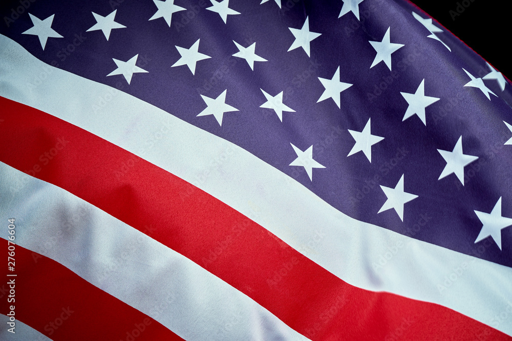 US flag waving in wind on Independence Day in America US flag waving in wind on Independence Day in America