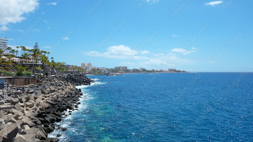 Sunny day in Playa de Las Americas, a lively expansive resort in the south western part of the island, with numerous water attractions, hotels, venues and restaurants, Tenerife, Canary islands, Spain