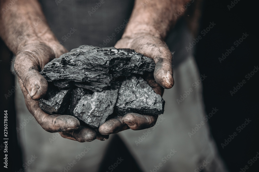 Coal in miner holds. Concept industry mining Coal in miner holds. Concept industry mining