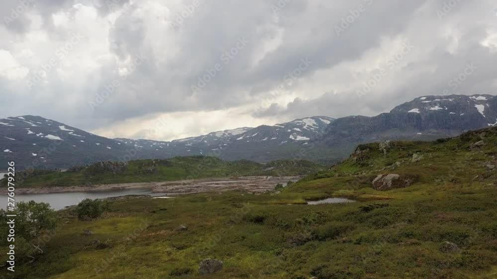 Aerial rising shot of beautiful Norwegian Mountain Landscape with clouds Aerial rising shot of beautiful Norwegian Mountain Landscape with clouds