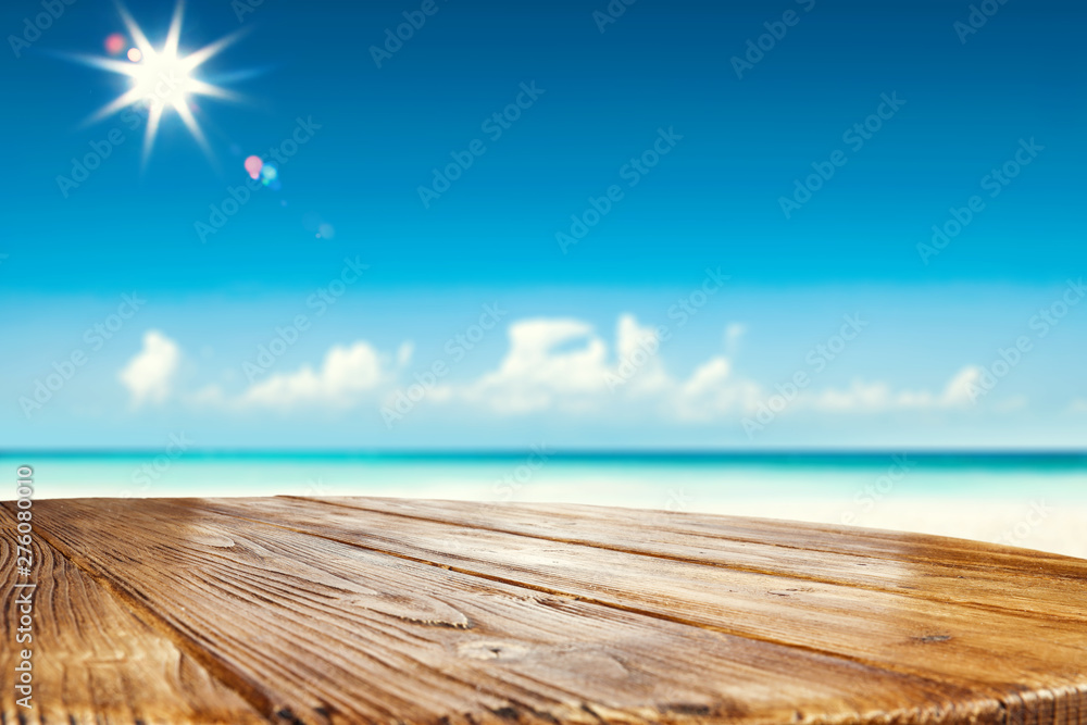 Desk of free space and summer beackground of beach with sea