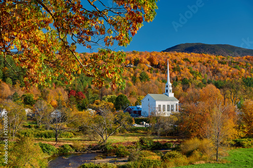 Iconic New England church in Stowe town at autumn in Vermont, USA photo
