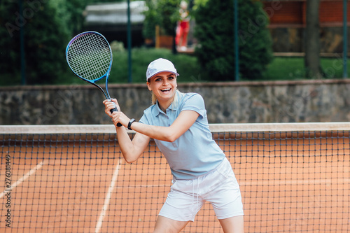 Woman playing tennis and waiting for the service... Healthy and sport concept.