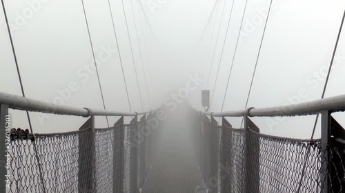 Europe's highest suspension bridge in the fog.
The suspension bridge is located on the Stubnerkogel in Bad Gastein. photo
