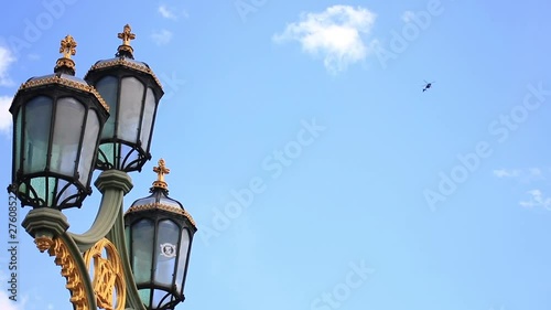 Close-Up Of The Street Lamp And The Helicopter Over The City Of London, England, United Kingdom. photo