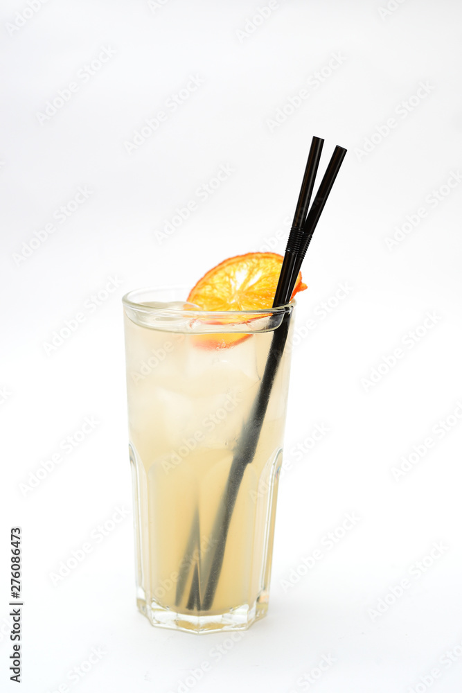 lemonade with a slice of dried orange in a transparent glass on a white background lemonade with a slice of dried orange in a transparent glass on a white background