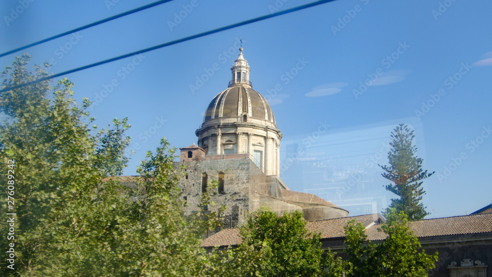 Dome of the cathedral of Catania photographed from the train