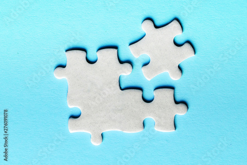 White details of puzzle on a blue background