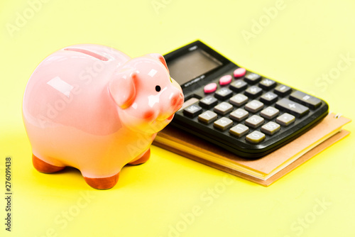 bookkeeping. financial report. money saving. Accounting and payroll. moneybox with calculator. Piggy bank. capital management. planning counting budget. Commerece business. fortune photo