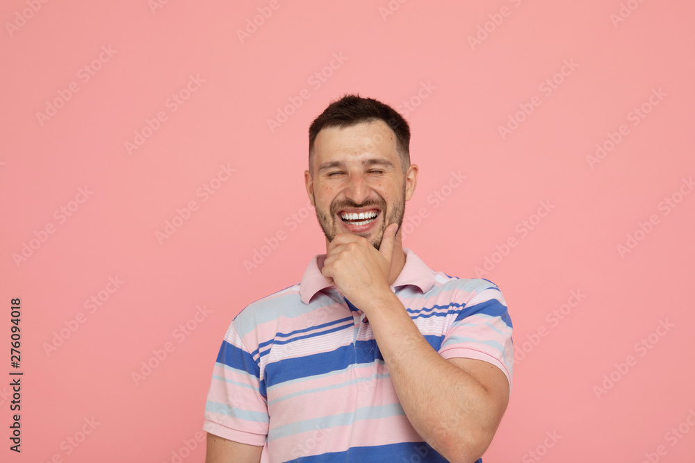 Handsome man over pink background laughing. Handsome man over pink background laughing.