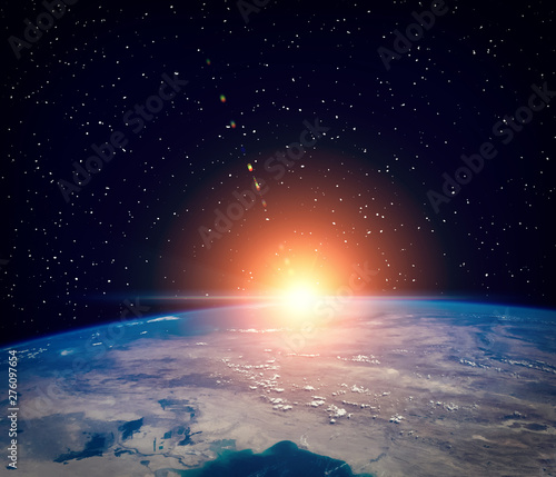 Fototapeta Naklejka Na Ścianę i Meble -  Thrilling sunrise from space. The elements of this image furnished by NASA.