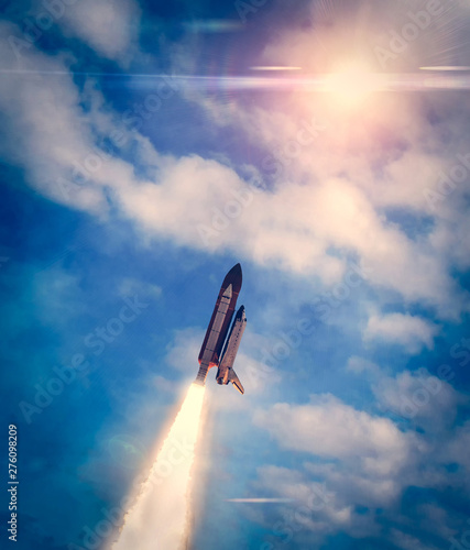Heavy Carrier Rocket Launch into blue sky. Space mission. Elements of this image furnished by NASA.