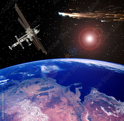 Fototapeta Naklejka Na Ścianę i Meble -  Space station above the earth. Meteors, comets in space. The elements of this image furnished by NASA.
