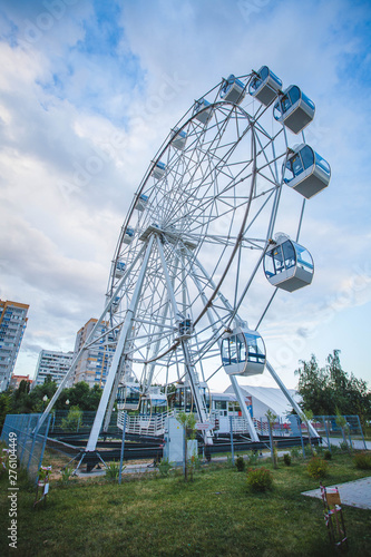 Ferris wheel on sky background in amusement park