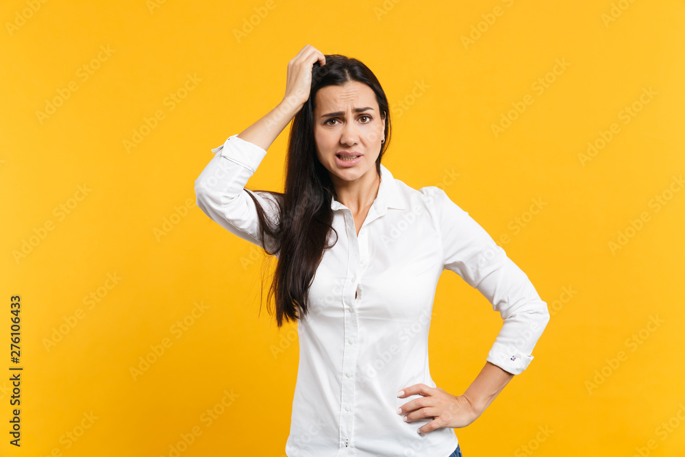 Preoccupied Images Portrait of preoccupied worried young woman in white shirt looking ...