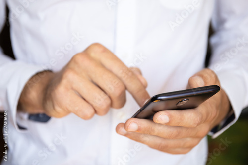 close-up of male hands with a smartphone