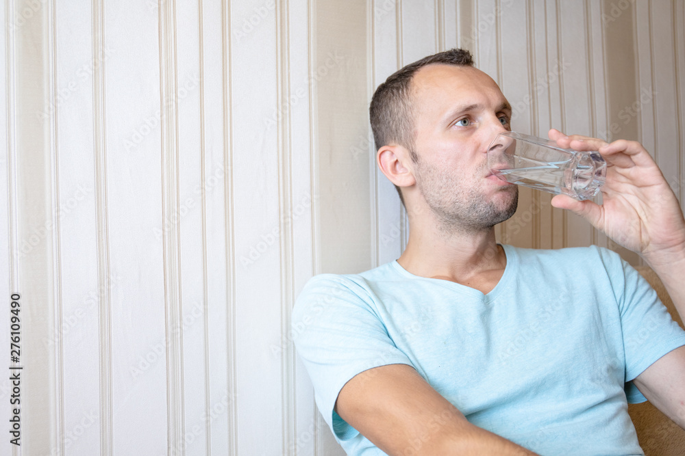 the guy is drinking clean glass water the guy is drinking clean glass water