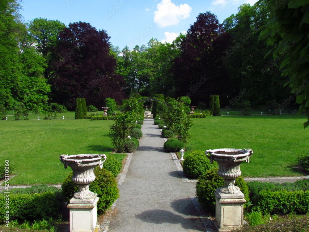 Baroque castle garden with stone flower container, french style park, gardening