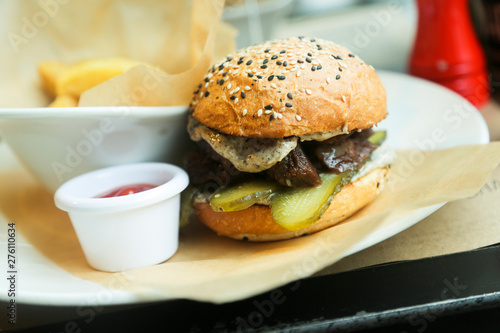 Beef burger with pickles and truffle sauce