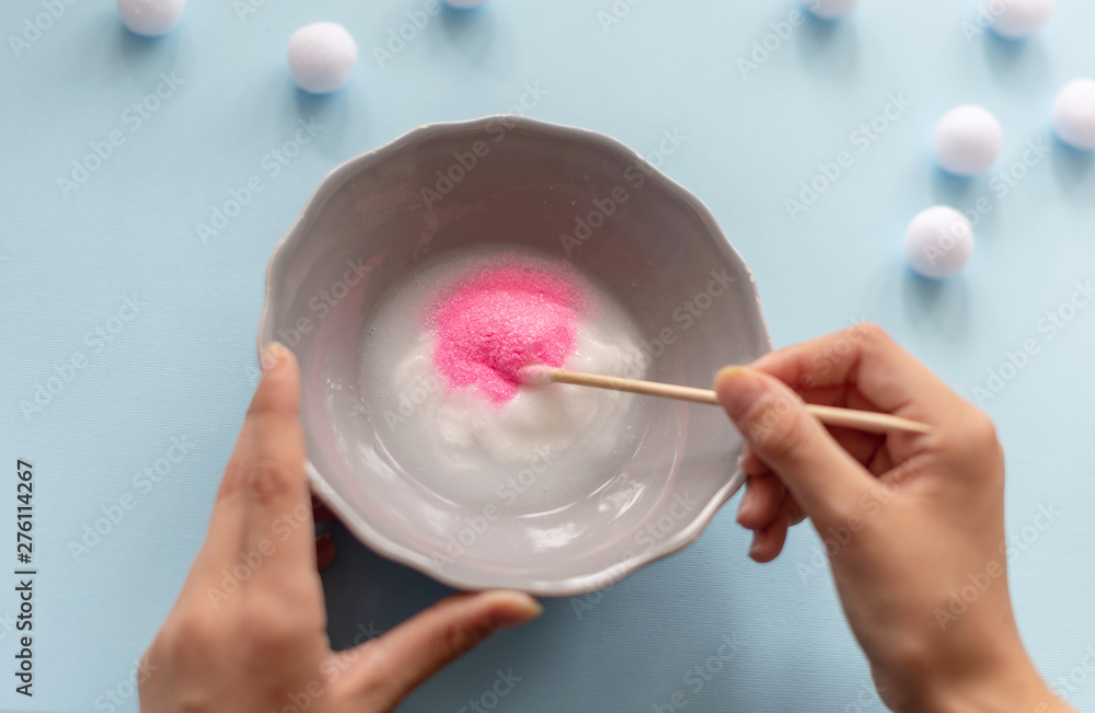 a girl making slime herself. child making slime. a girl making slime herself. child making slime.