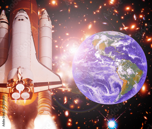 Fototapeta Naklejka Na Ścianę i Meble -  Rocket (shuttle) and earth globe. The elements of this image furnished by NASA.
