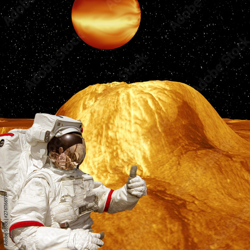 Astronaut gives thumbs up on the extrasolar planet. Strange stony landscape on the background. The elements of this image furnished by NASA.