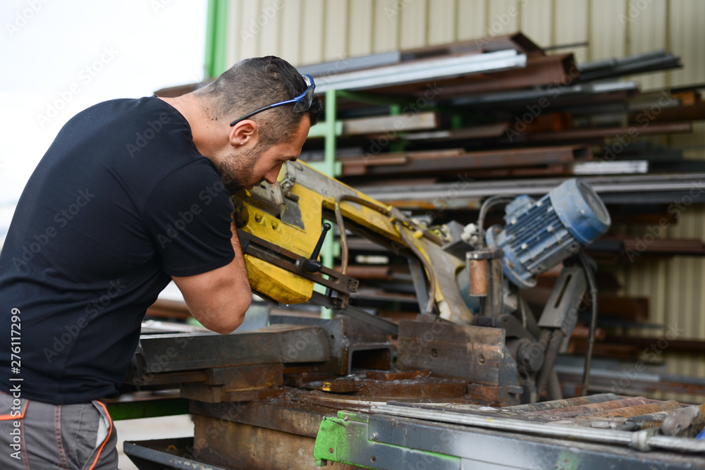 handsome man working in a workshop steel industry factory construction metallurgy machine site handsome man working in a workshop steel industry factory construction metallurgy machine site