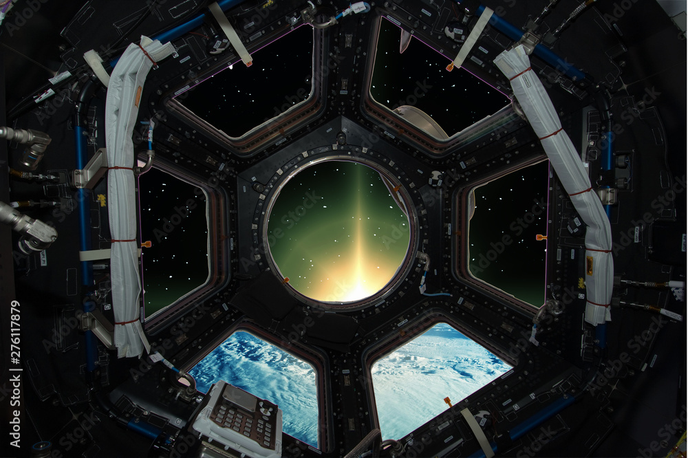 Fascinating sunrise on earth. Spaceship window view. Elements of this image furnished by NASA. Fascinating sunrise on earth. Spaceship window view. Elements of this image furnished by NASA.