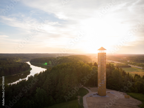 Aerial shot of wooden observation tower near the river loop