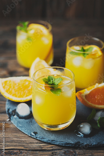 Fresh summer cocktail with orange and mint