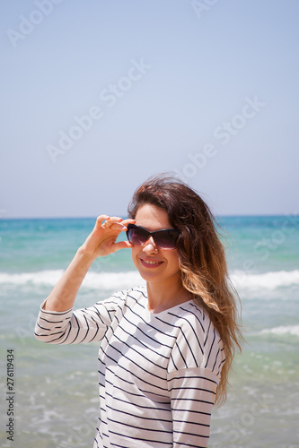 european girl having fun on the sea beach