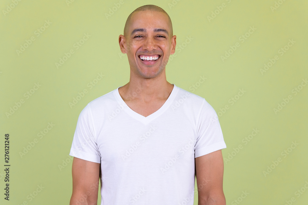 Portrait of happy handsome bald man smiling - obrazy, fototapety, plakaty 