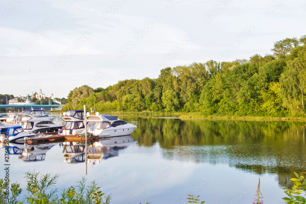 Yaroslavl. View of the Parking boats on the Kotorosl river and the Spaso-Preobrazhensky monastery. Summer evening before sunset