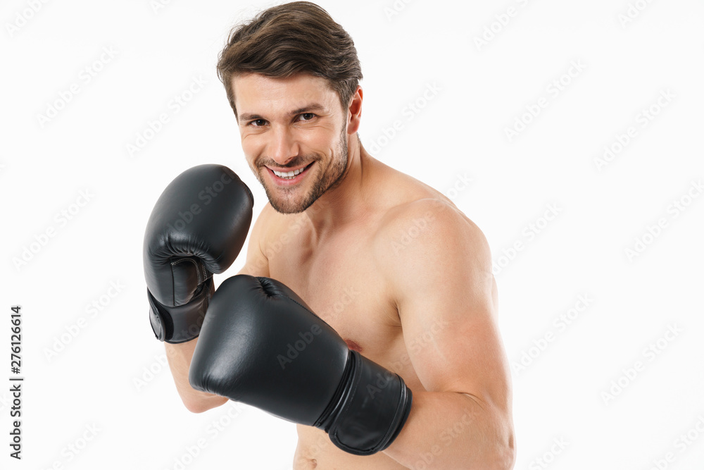 Handsome young fit shirtless sportsman standing