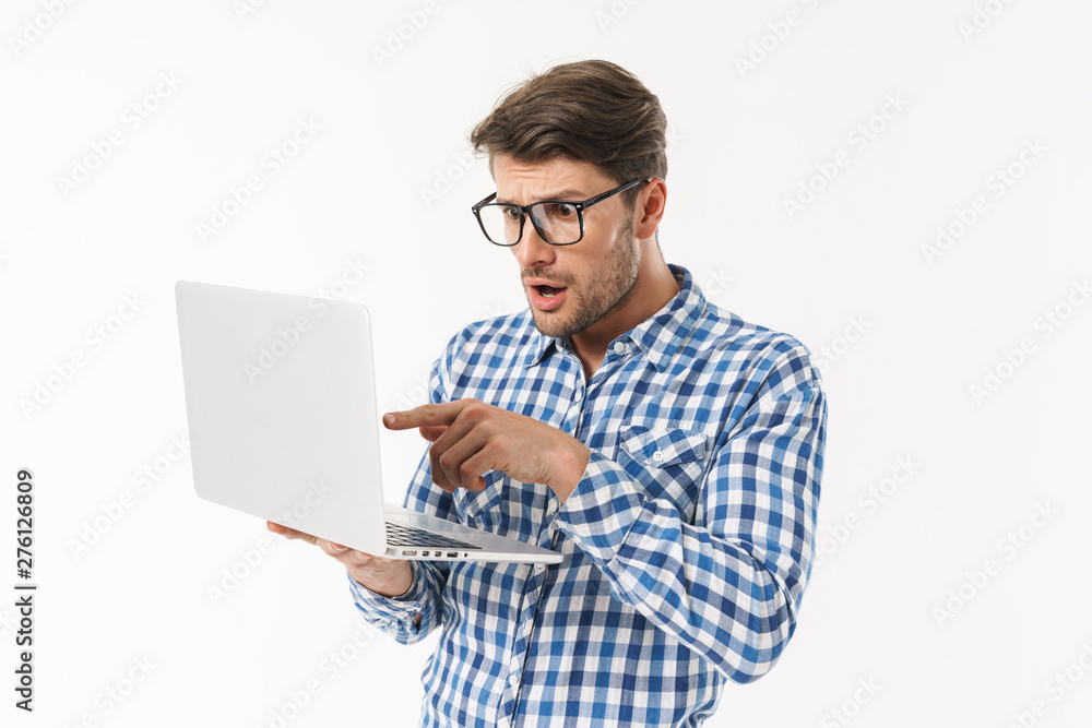 Attractive young brunette man wearing plaid shirt Attractive young brunette man wearing plaid shirt
