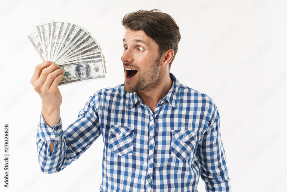 Attractive young brunette man wearing plaid shirt Attractive young brunette man wearing plaid shirt