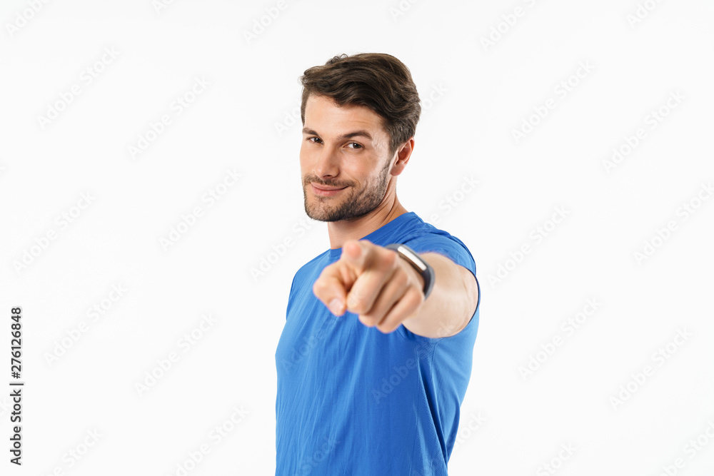 Fototapeta premium Attractive young fit sportsman wearing t-shirt standing