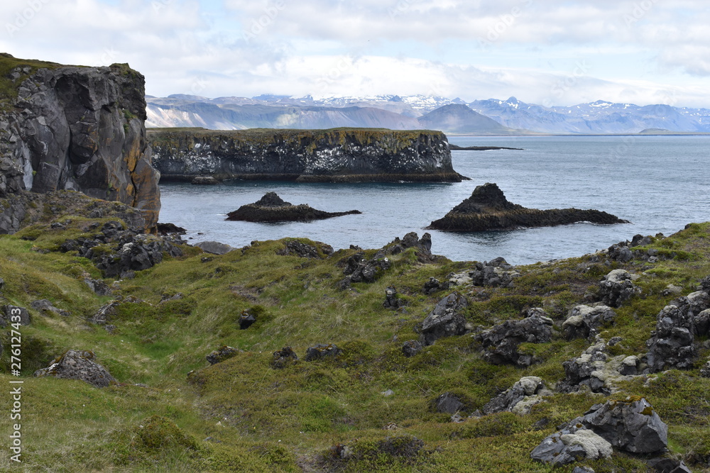 Hiking trail from Anarstapi to Hellnar with the raw ocean und big rocks and mountains in the west of Iceland at Snaefellsnes Peninsula Hiking trail from Anarstapi to Hellnar with the raw ocean und big rocks and mountains in the west of Iceland at Snaefellsnes Peninsula