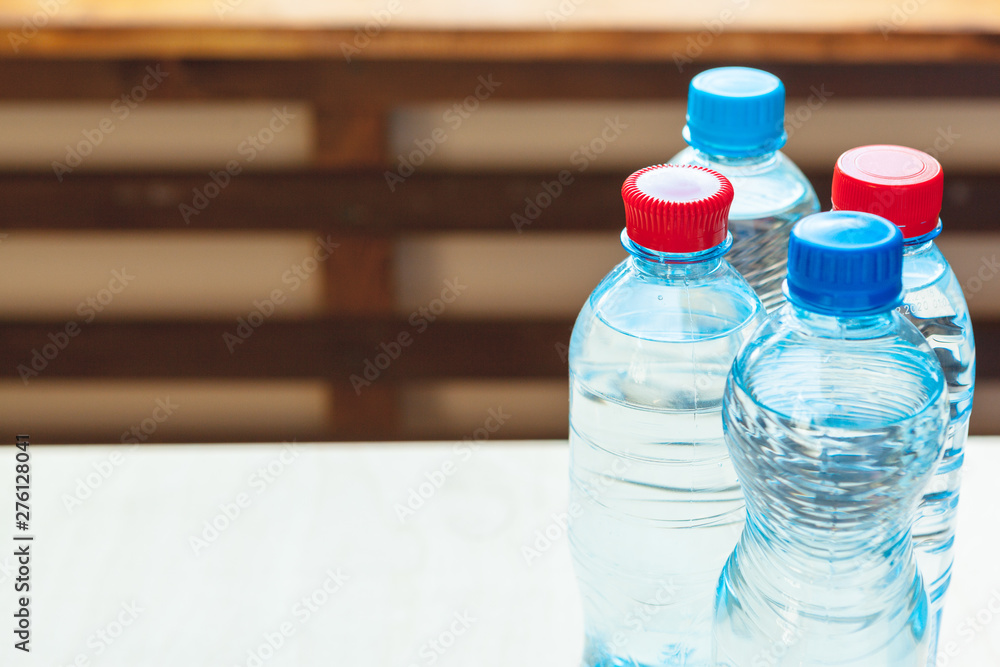 Full closed plastic water bottles. Close up