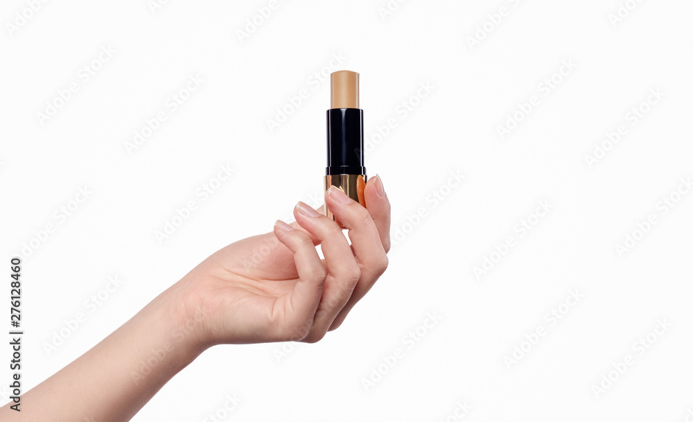 Crop hand with beige lipstick Crop hand with beige lipstick